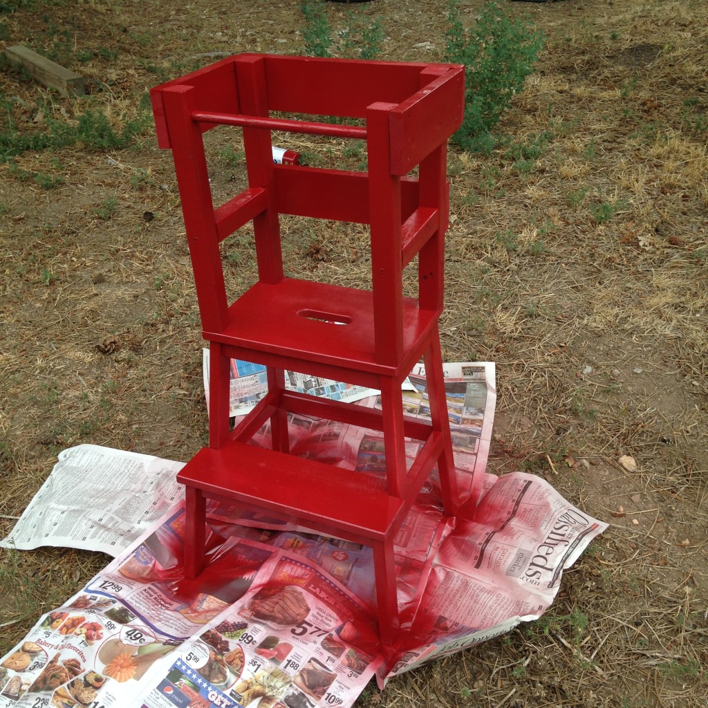 It took a little less than two cans of Rustoleum spray paint to paint the tower red. The spray paint we chose had primer in it so it wouldn't just soak into the wood.